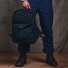 Filson Journeyman Backpack Navy wearing in hand