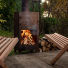 Weltevree Outdooroven in garden with Weltevree Fieldchairs