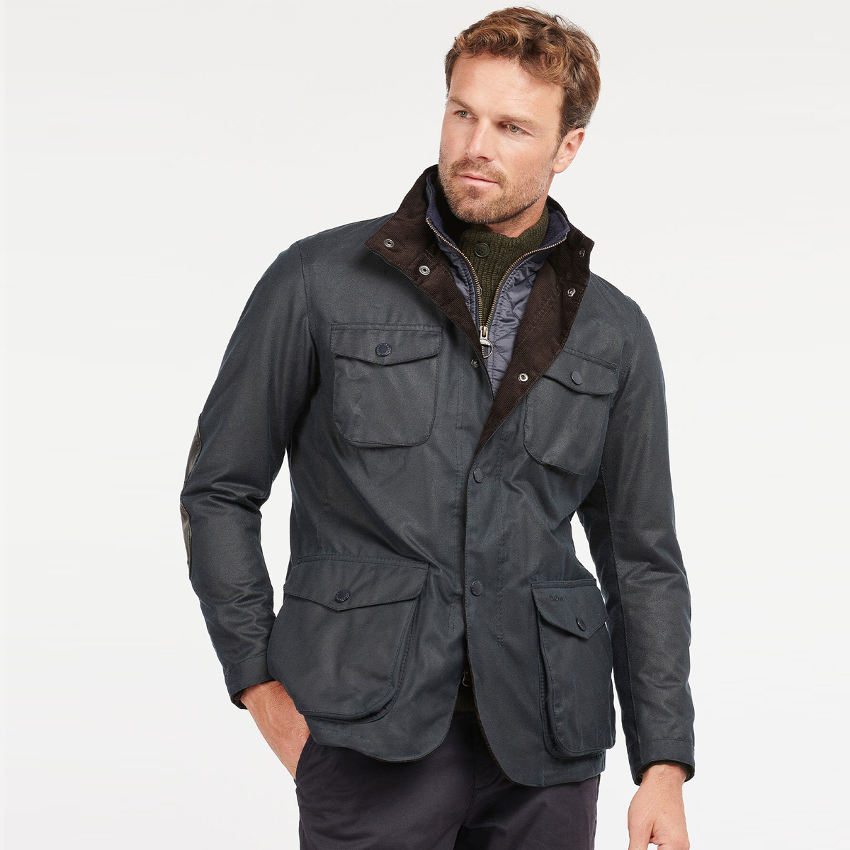 Barbour Ogston Wax Jacket Navy, Stijlvolle outdoorjas in robuust gewaxed katoen.