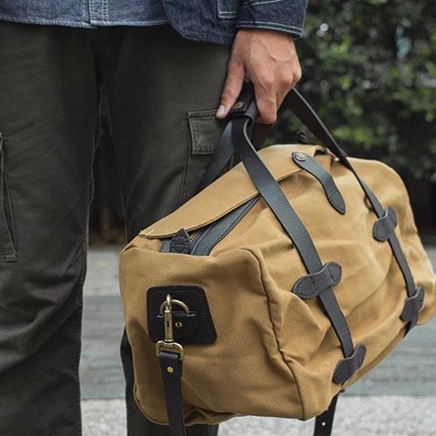 tan duffle bag