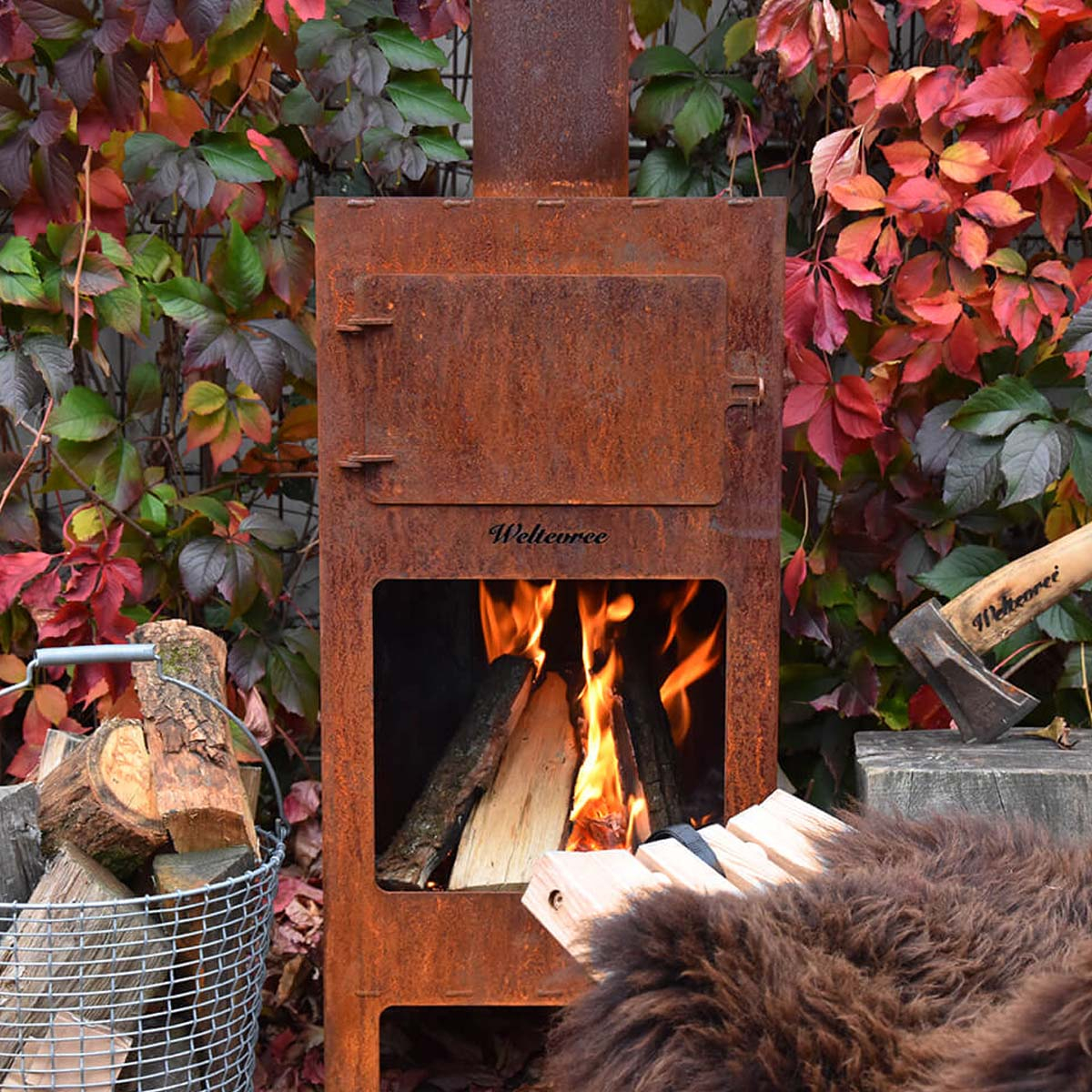 Weltevree Outdooroven mooi roestkleurig, samen met Weltevree Fieldchair